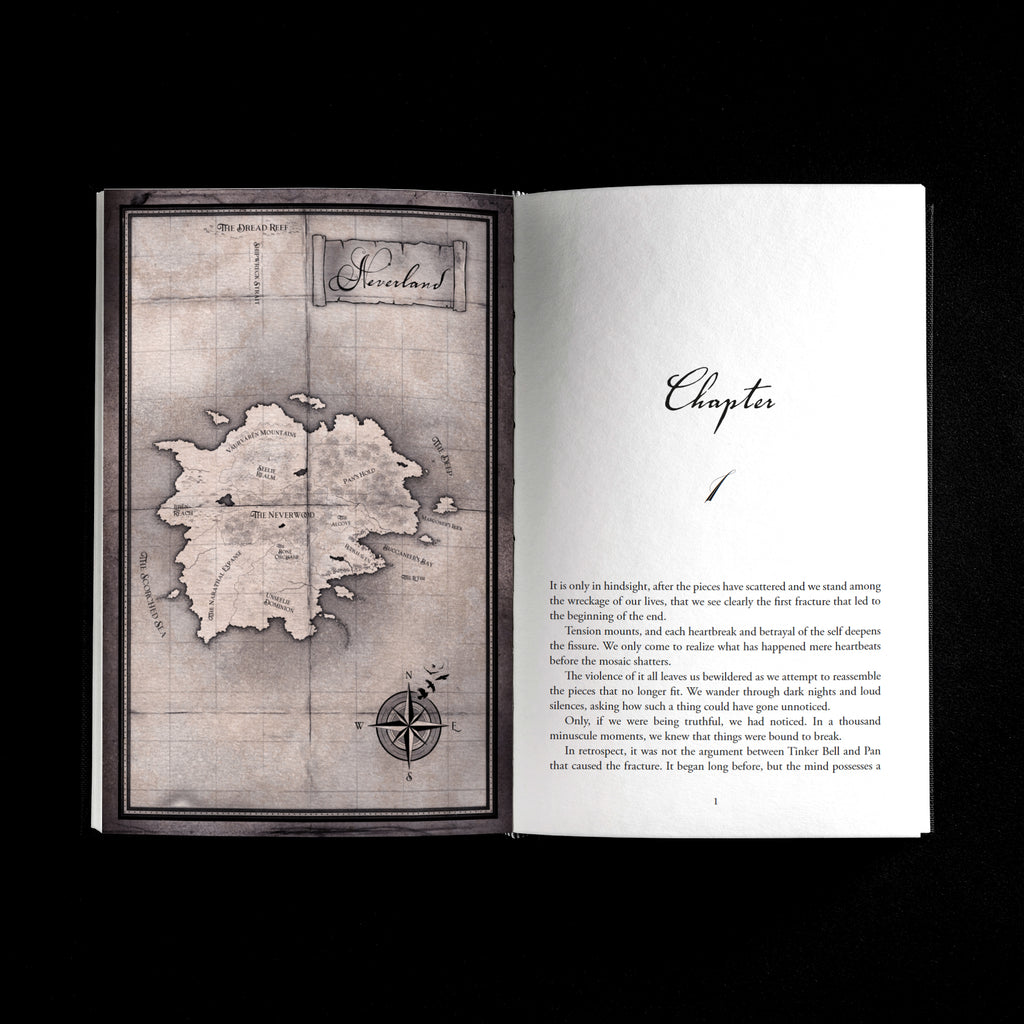 An open book laid flat against a black background, showing a vintage-style, hand-drawn map of an island labeled 'Neverland' on the left page and a printed chapter title 'Chapter 1' with body text on the right page.