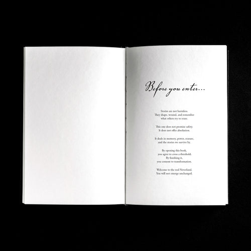 An open book laid flat against a solid black background, showing a white interior spread with the heading 'Before you enter.'